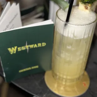 a drink with a pineapple garnish