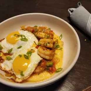 Low Country Shrimp &amp; Grits 
Spiced Shrimp, Creamy Andouille-Cheddar Grits, Creole Butter Sauce