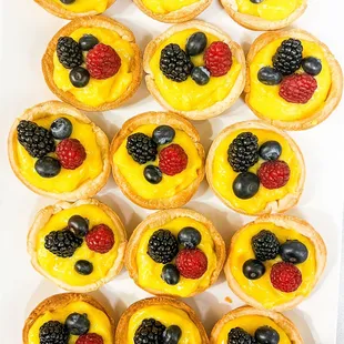 a tray of fruit tarts