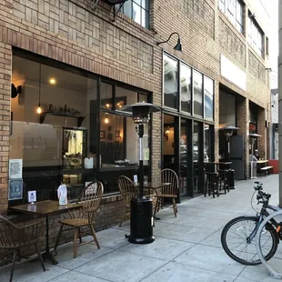 Outdoor seating and headlamp along Divisadero.