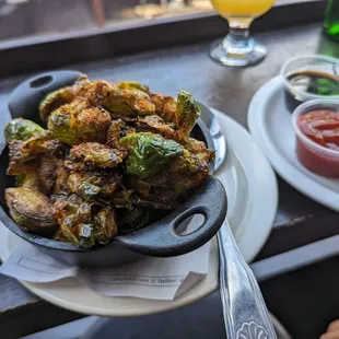 a bowl of fried brussels sprouts