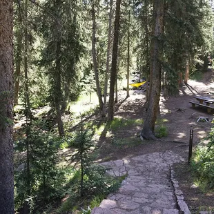 Site 6 &amp; 7. Parking is right next to the vault toilets. You&apos;ll have to walk all your gear downstairs to reach these campsites.