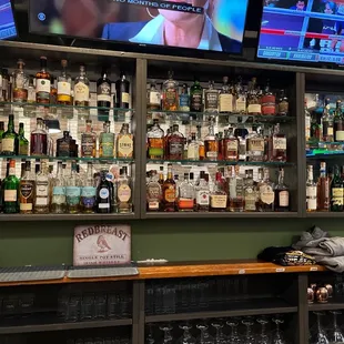 a bar with many bottles of alcohol