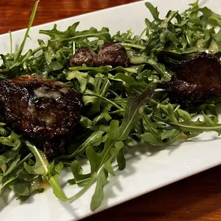 Lamb skewers and aragula