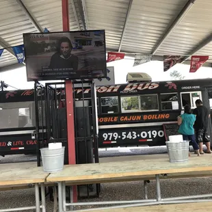 a group of people standing in front of a food truck