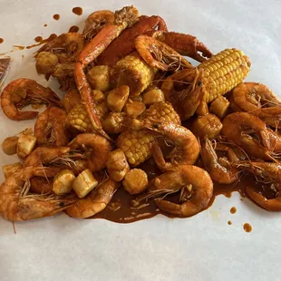 a pile of shrimp and corn