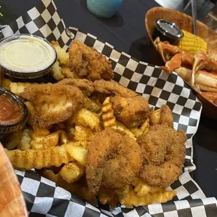 a basket of fried fish and fries