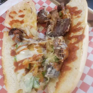 Wildcat: Brisket, onions, peppers, provolone, and bbq sauce. Only thing missing...the brisket!
