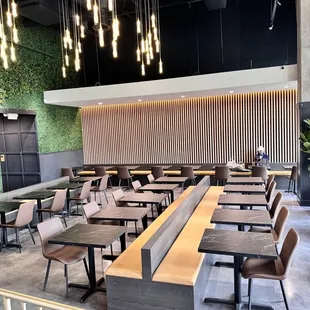 an empty restaurant with tables and chairs