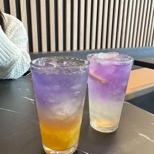 two different colored drinks on a table