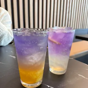 two different colored drinks on a table