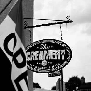 a black and white photo of a sign