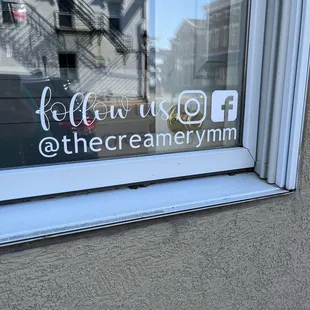 the reflection of a building in the window