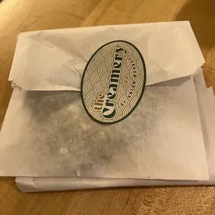 a paper bag with a logo on it