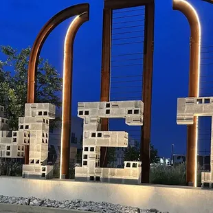 a large sculpture of blocks in the shape of a cage