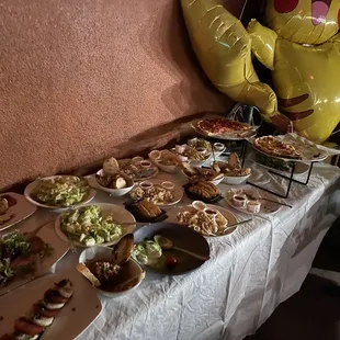 Half of the spread. Pizza on the table to the right. Everything was delicious!