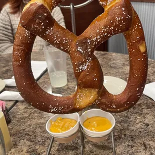 Giant pretzel appetizer with spicy cheese