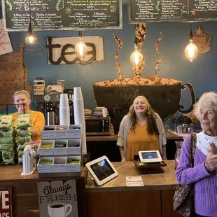 two women standing behind the counter