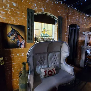 a white chair and a fireplace