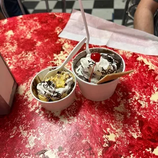 Half-eaten black &amp; gold crunch junior sundae, and a classic sundae with banana pudding and bittersweet chocolate torte