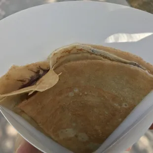 a person holding a crepe