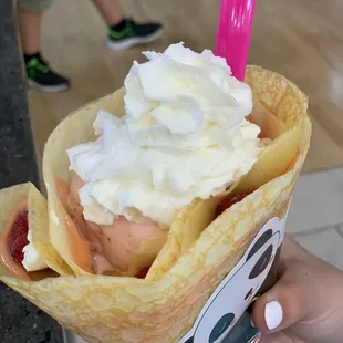 a person holding a crepe
