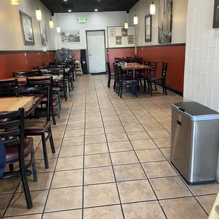 a restaurant with tables and chairs
