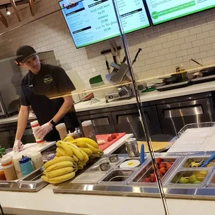 a man preparing food in a restaurant