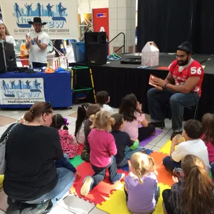 UNM Lobo Football players reading at one of our events.