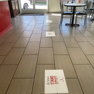 Social Distancing floor markers inside