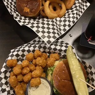 Plain Jane burger and onion rings up top, spicy queso burger and tater tots on bottom