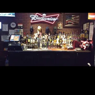 a bar with bottles of alcohol