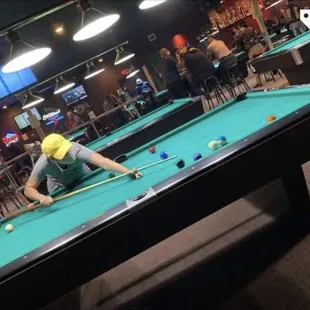 a man playing pool