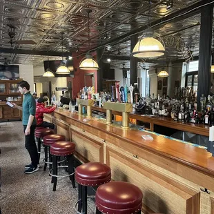 a woman standing at the bar