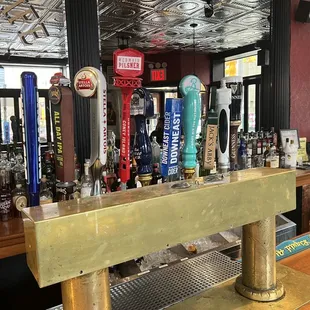 a row of beer taps