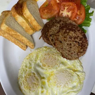 3 eggs, sausage, toast and tomatoes