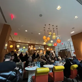 a large group of people sitting at tables