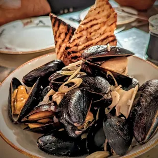 a plate of steamed mussels
