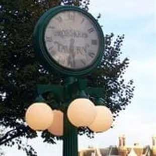 Customized clock in front of bar.