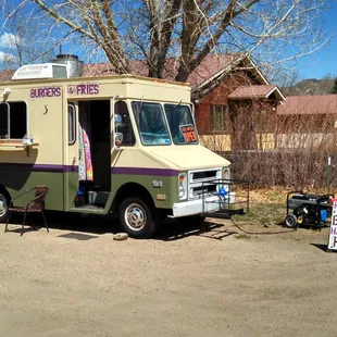 Look for the tan and green truck