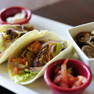 Beef Fajita Taco - Includes beef, onion, and green pepper, dressed with shredded cheddar, tomato, and lettuce.