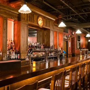 a bar with a clock on the wall
