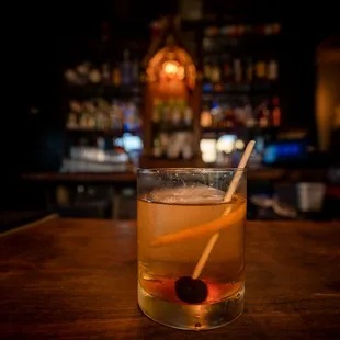 a drink in a glass with a spoon