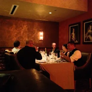 a group of people sitting at a table