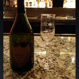 a bottle of wine and a glass