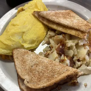 Create your own omelette (sausage, mushroom, and cheddar), home fries, and wheat toast