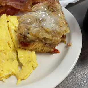 Cherry French toast casserole ! Honestly the most delicious thing I've ever had for breakfast ! Comes with eggs and meat for $7.99!