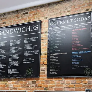 a menu on a brick wall
