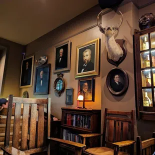 Inside. Cool decor. Old portraits and hunting trophies. Front of house.