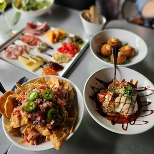 Left to right - pita nachos, meat and cheese board, Risotto balls and meatballs
